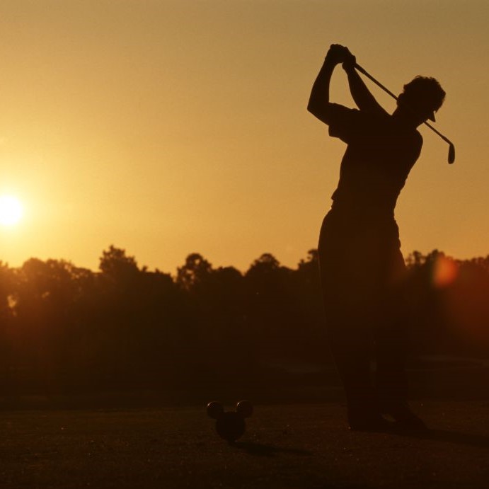 golfer in orange sunset